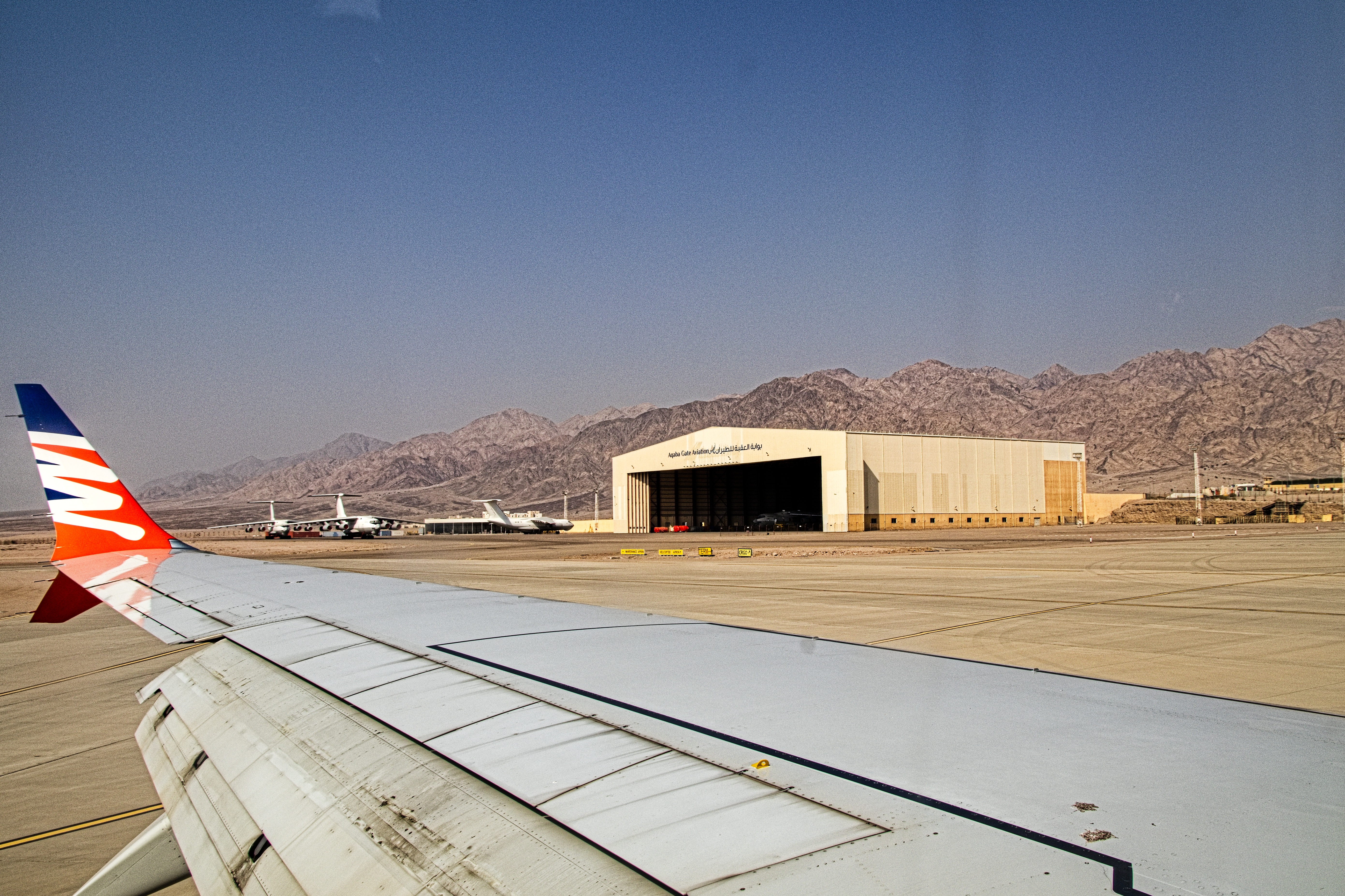 flights to king hussein international airport